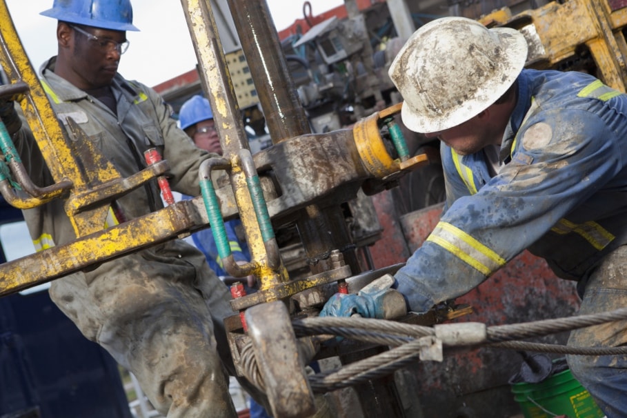 Field specialists working together on drilling equipment