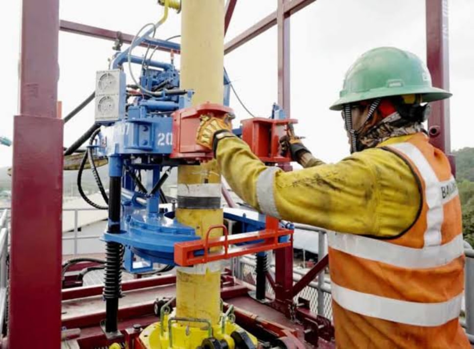 Field technician operating well service equipment at the wellhead