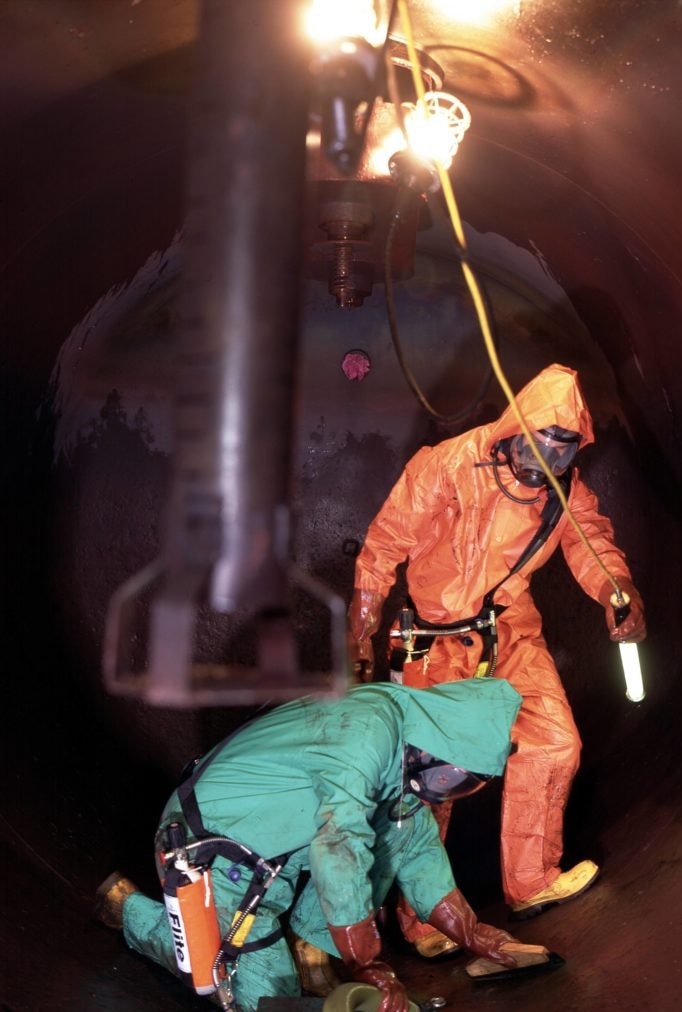 Specialists carrying out a confined-space tank cleaning operation