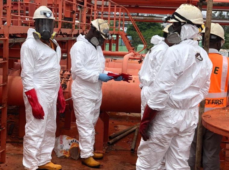 Specialist environmental crew working in protective equipment