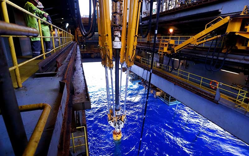 Offshore intervention equipment deployed through a rig floor